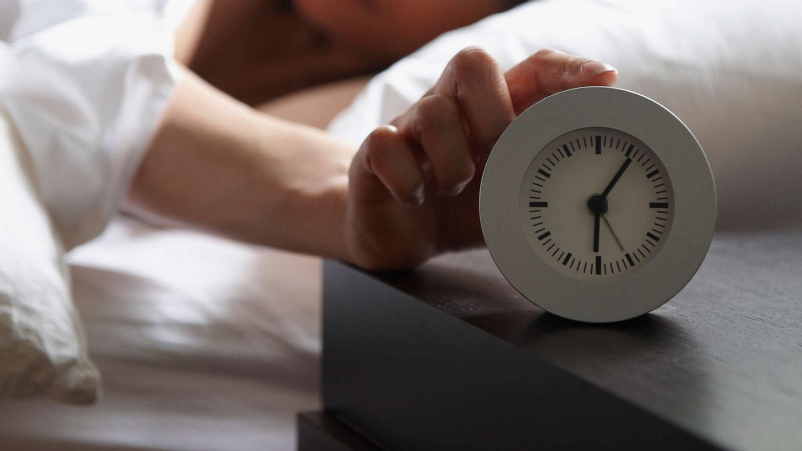 PHOTO: A woman lays in bed in this stock photo.