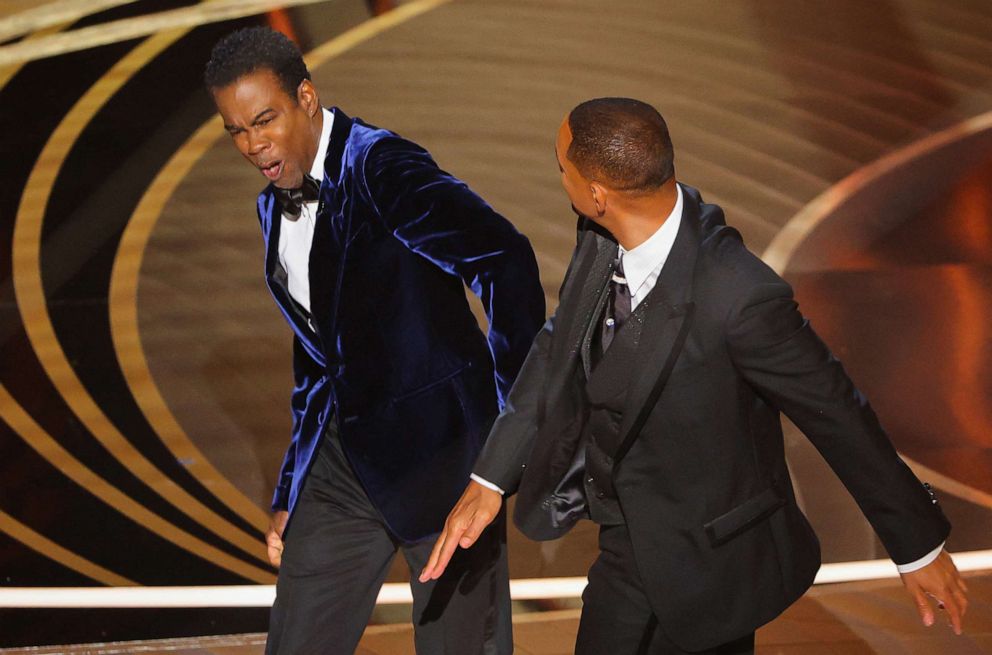 PHOTO: Will Smith hits Chris Rock as Rock spoke on stage during the 94th Academy Awards in Hollywood, Calif., March 27, 2022.