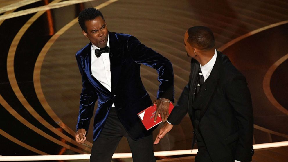 PHOTO: Will Smith, right, slaps Chris Rock onstage after Rock made a joke about Smith's wife Jada Pinkett Smith during the 94th Oscars at the Dolby Theatre in Hollywood, March 27, 2022. 