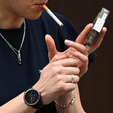 PHOTO: A woman is seen smoking a cigarette in central London on June 9, 2022.