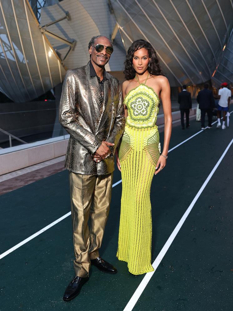 PHOTO: Snoop Dogg and Cindy Bruna arrive at 'Prelude To The Olympics' at Fondation Louis Vuitton, on July 25, 2024, in Paris.