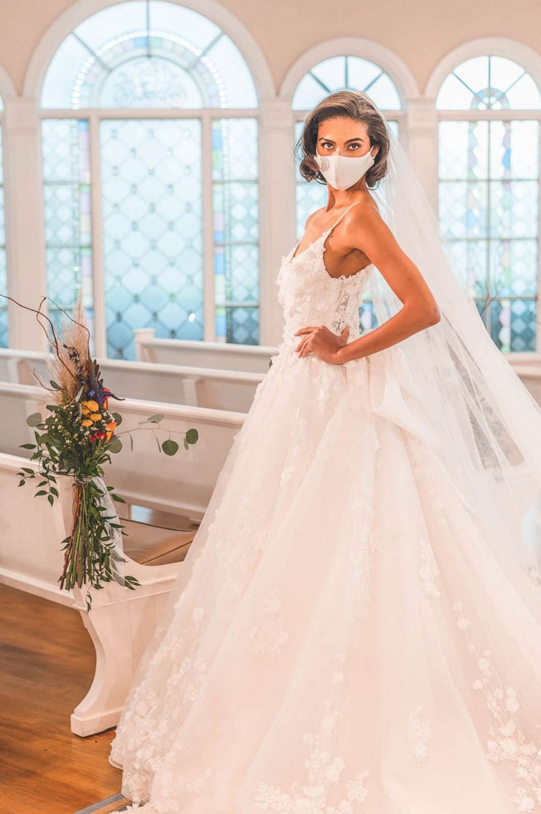 PHOTO: Model wears Disney Weddings Snow White Platinum Dress, which is inspired by the princess's grace and beauty and features a sweetheart neckline and organza bow.