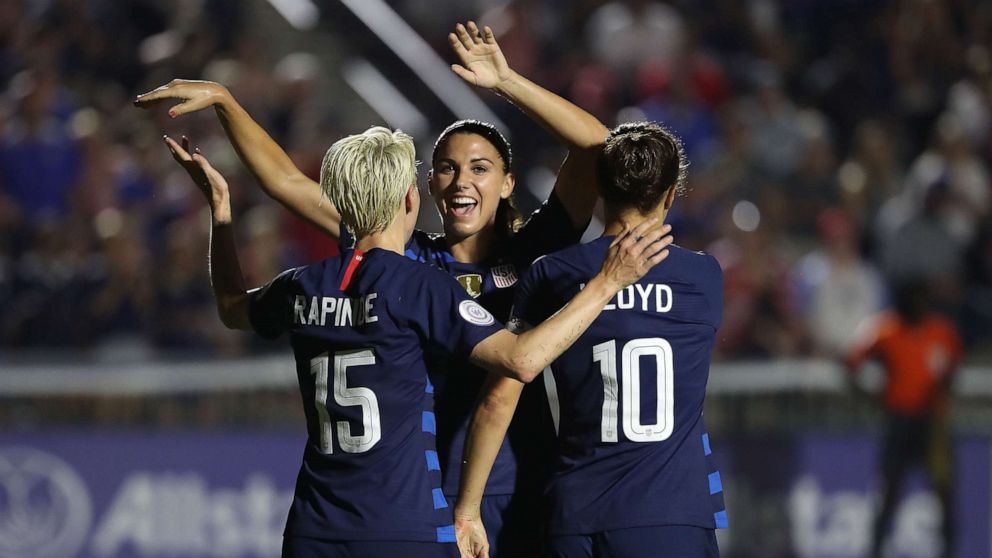 PHOTO: Megan Rapinoe reacts after scoring a goal as she celebrates with teammates Alex Morgan and Carli Lloyd of USA against Mexico, Oct. 4, 2018 in Cary, N.C.