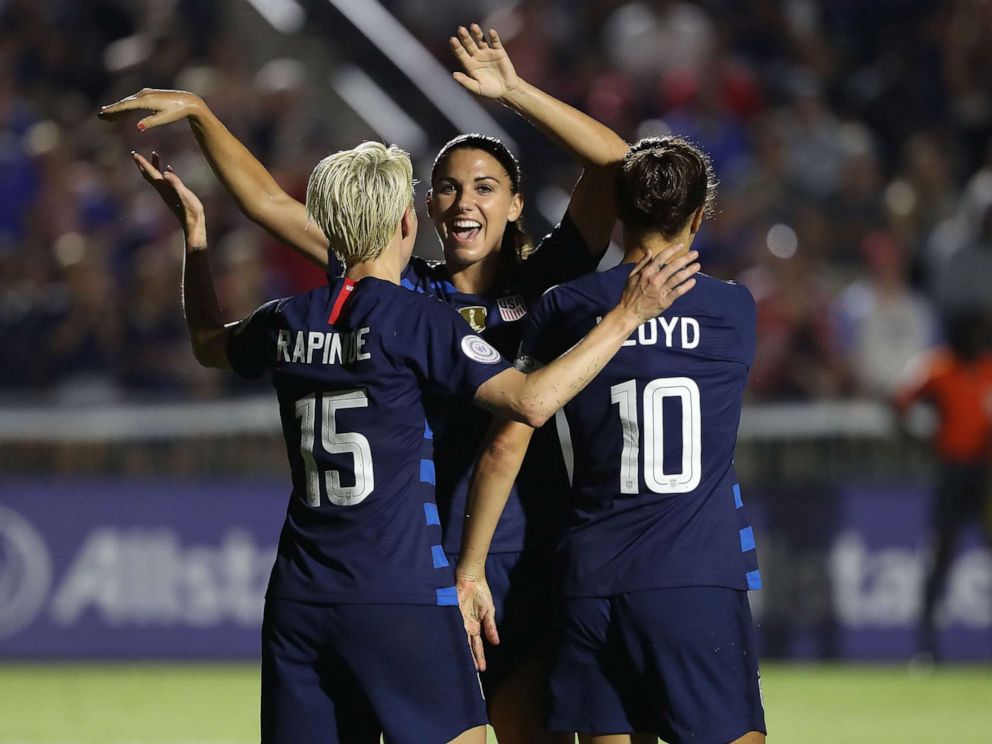 PHOTO: Megan Rapinoe reacts after scoring a goal as she celebrates with teammates Alex Morgan and Carli Lloyd of USA against Mexico, Oct. 4, 2018 in Cary, N.C.