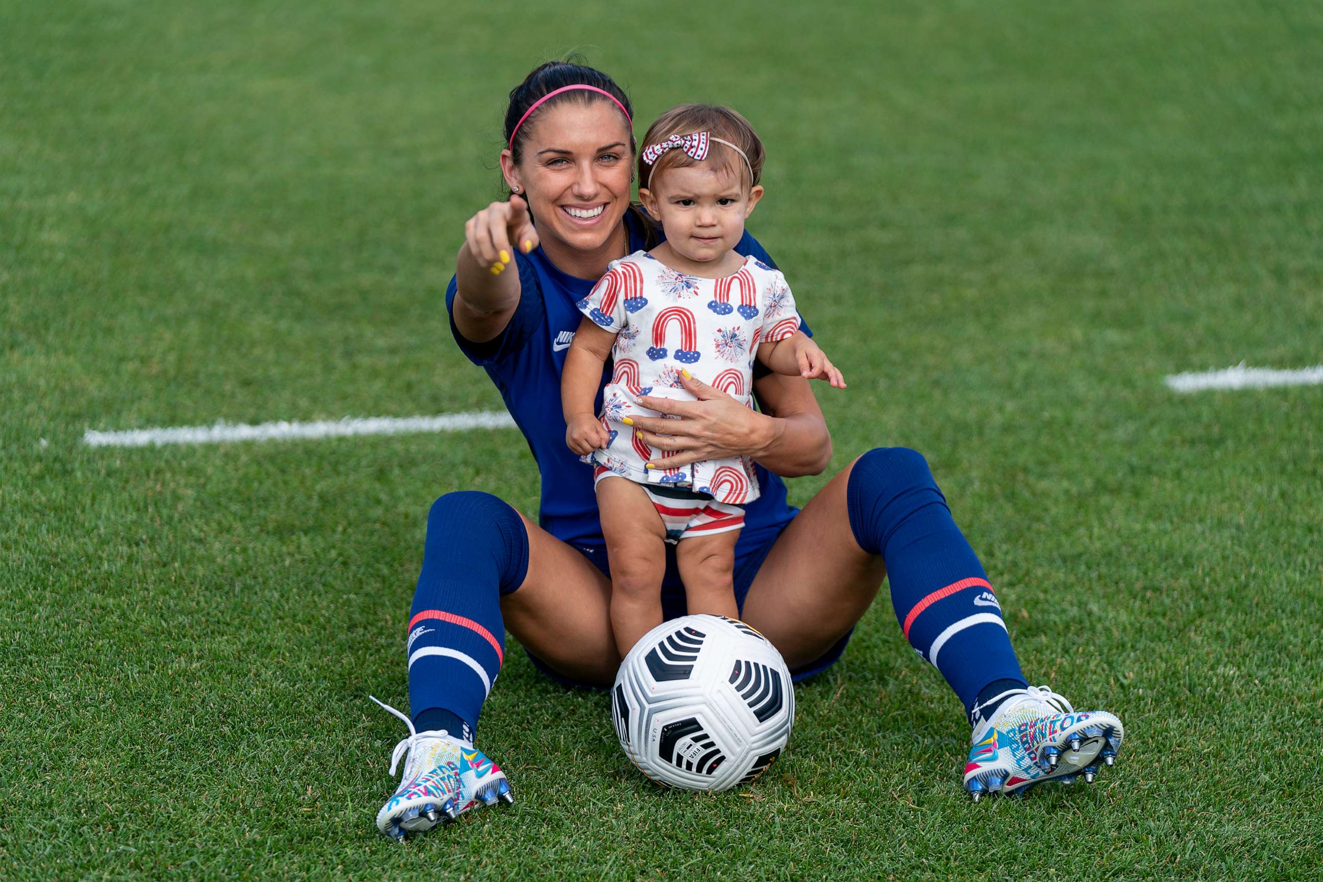 PHOTO: In this July 4, 2021 file photo Alex Morgan poses with her daughter, Charlie Carrasco at the practice fields in Hartford, Conn.