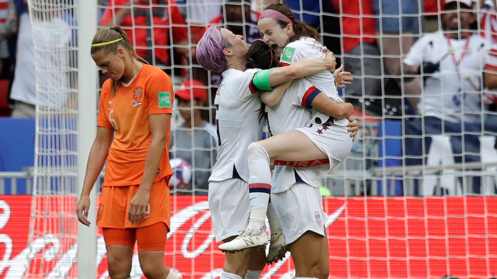 PHOTO: Americans Megan Rapinoe and Rose Lavelle celebrate at the Women's World Cup final in Lyon, France, July 7, 2019.