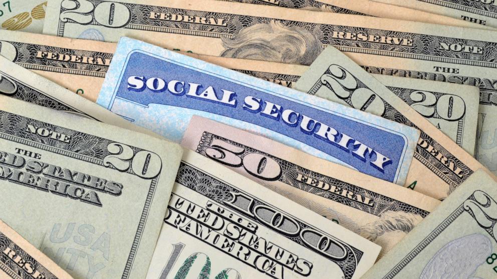 PHOTO: a social security card and money