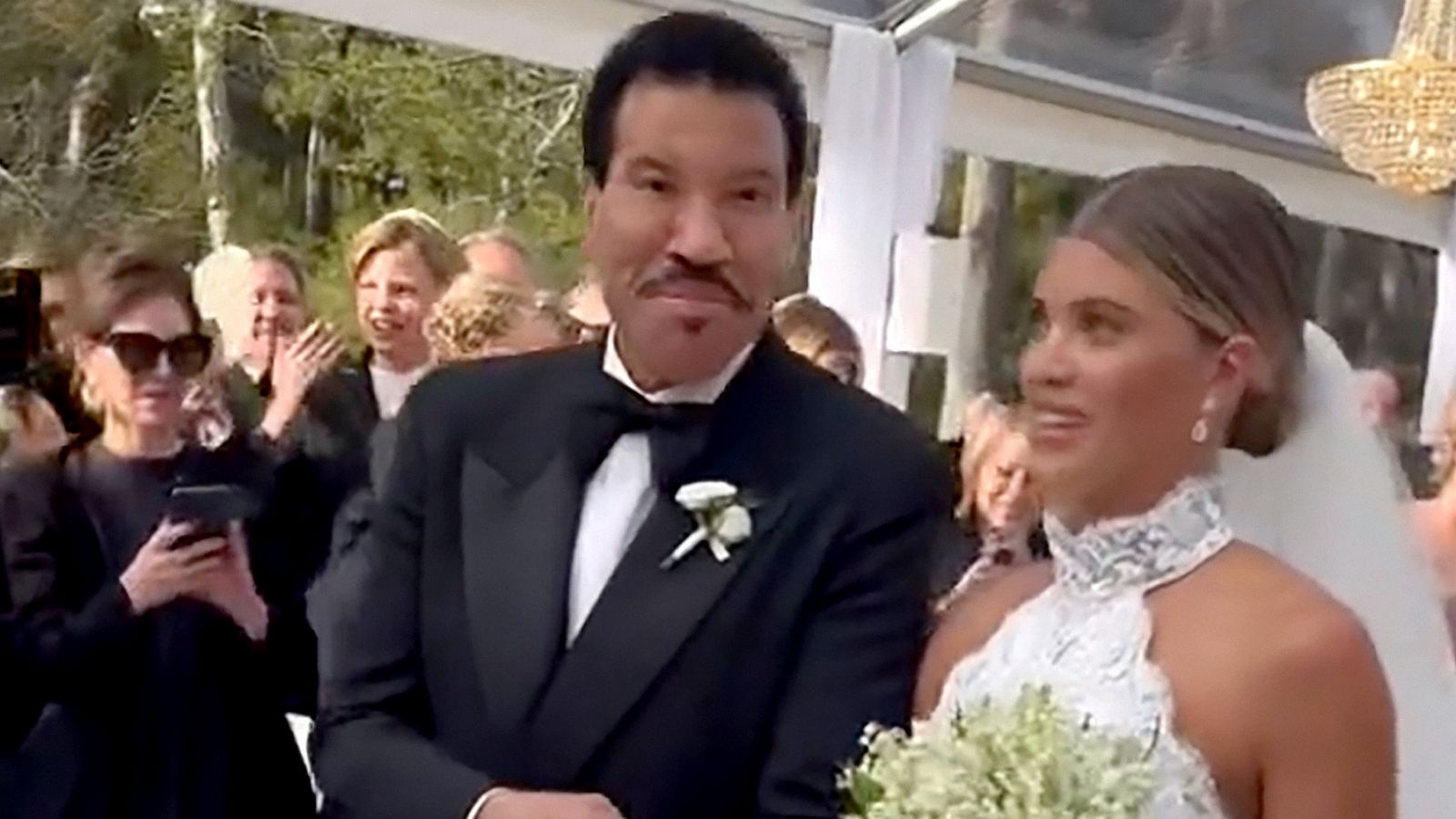 PHOTO: Lionel Richie walks his daughter Sofia Richie down the aisle at her wedding to Elliot Grainge in Antibes, France.