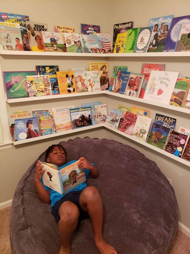 PHOTO: In May 2020, 7-year-old Curtis Rogers gained viral attention after throwing a backyard prom for his babysitter in Raleigh, North Carolina, after hers was cancelled due to COVID-19. Here, Curtis poses in an undated photo, reading inside his home.