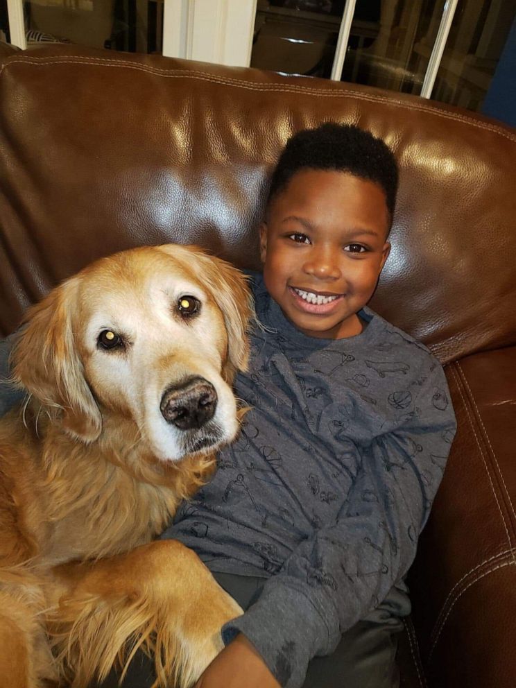 PHOTO: Curtis Rogers, 7, poses in a photo with his dog in Raleigh, North Carolina.