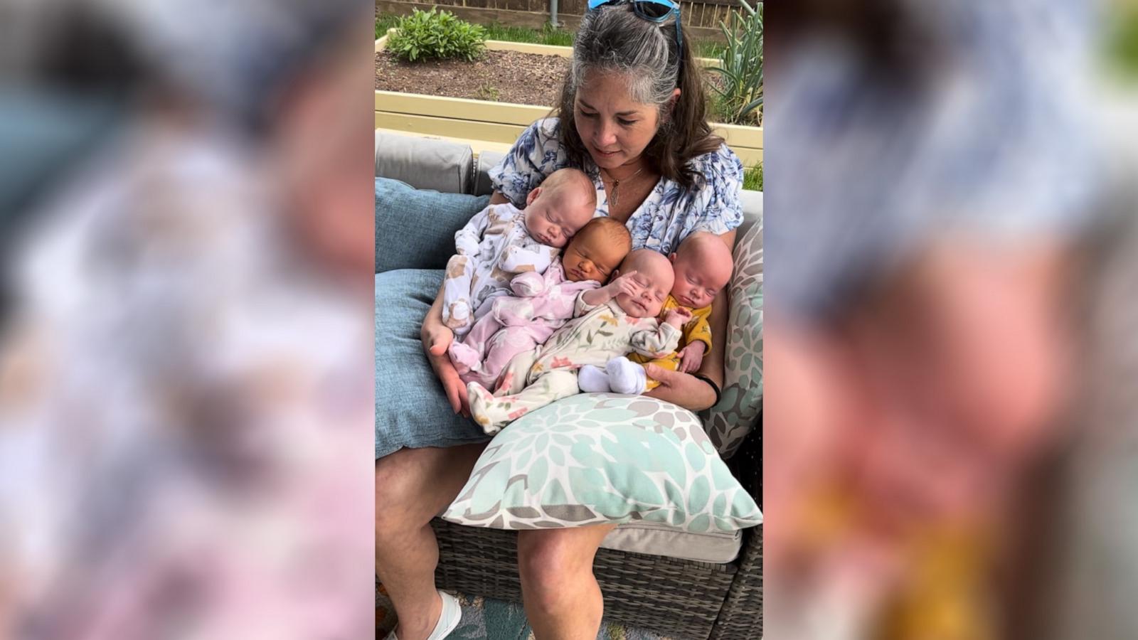 PHOTO: Amy Chizk holds four of her grandchildren – Winnie and triplets Elias, Emery and Lucy – in a viral TikTok video.