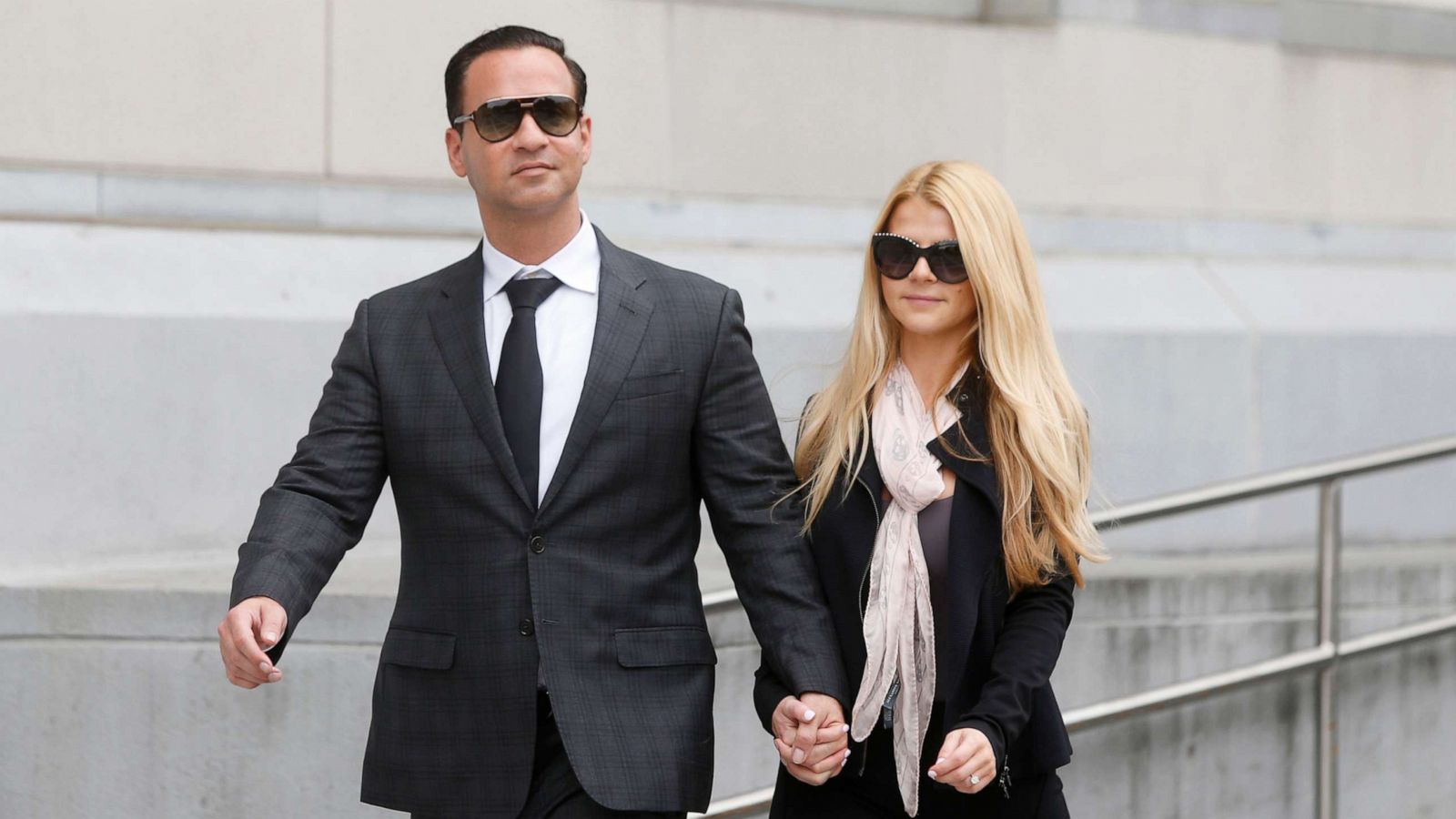 PHOTO: In this Oct. 5, 2018, file photo, Michael "The Situation" Sorrentino leaves federal court with his fiancee Lauren Pesce after his sentencing in Newark, N.J.