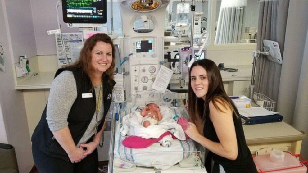 PHOTO: IDEA Bluff Springs school teachers visit Andrea, the newborn they helped deliver at the school.