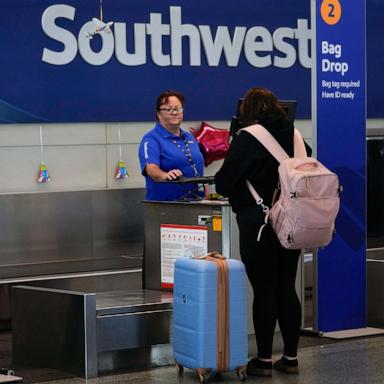 PHOTO: A Southwest Airlines traveler checks a bag at Midway International Airport, March 11, 2025, in Chicago.