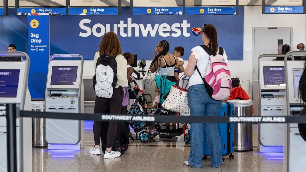 PHOTO: Travelers check in at the Southwest counter at Hartsfield-Jackson Atlanta International Airport (ATL) in Atlanta, Georgia, July 23, 2024.