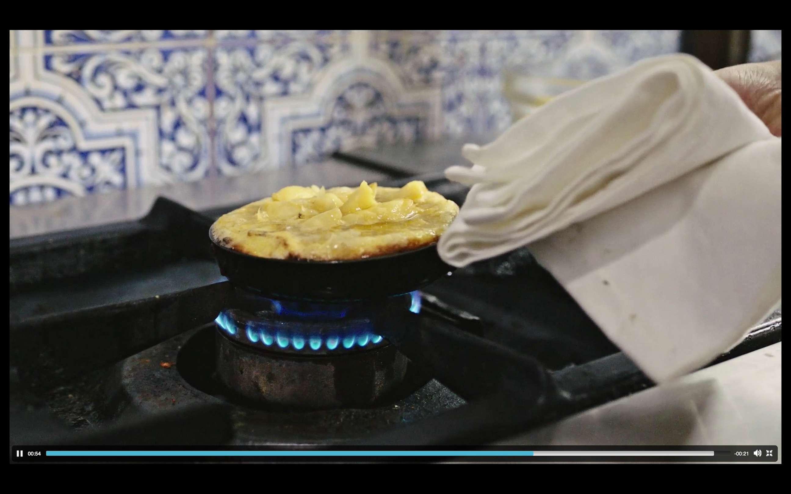 PHOTO: A small Spanish tortilla cooks in a pan.