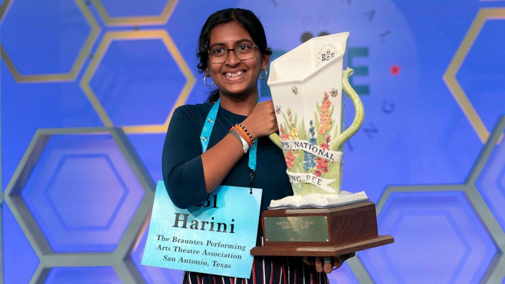 Harini Logan, 14, from San Antonio, Texas, holds her winning  Scripps National Spelling Bee trophy, June 2, 2022, in Oxon Hill, Md.