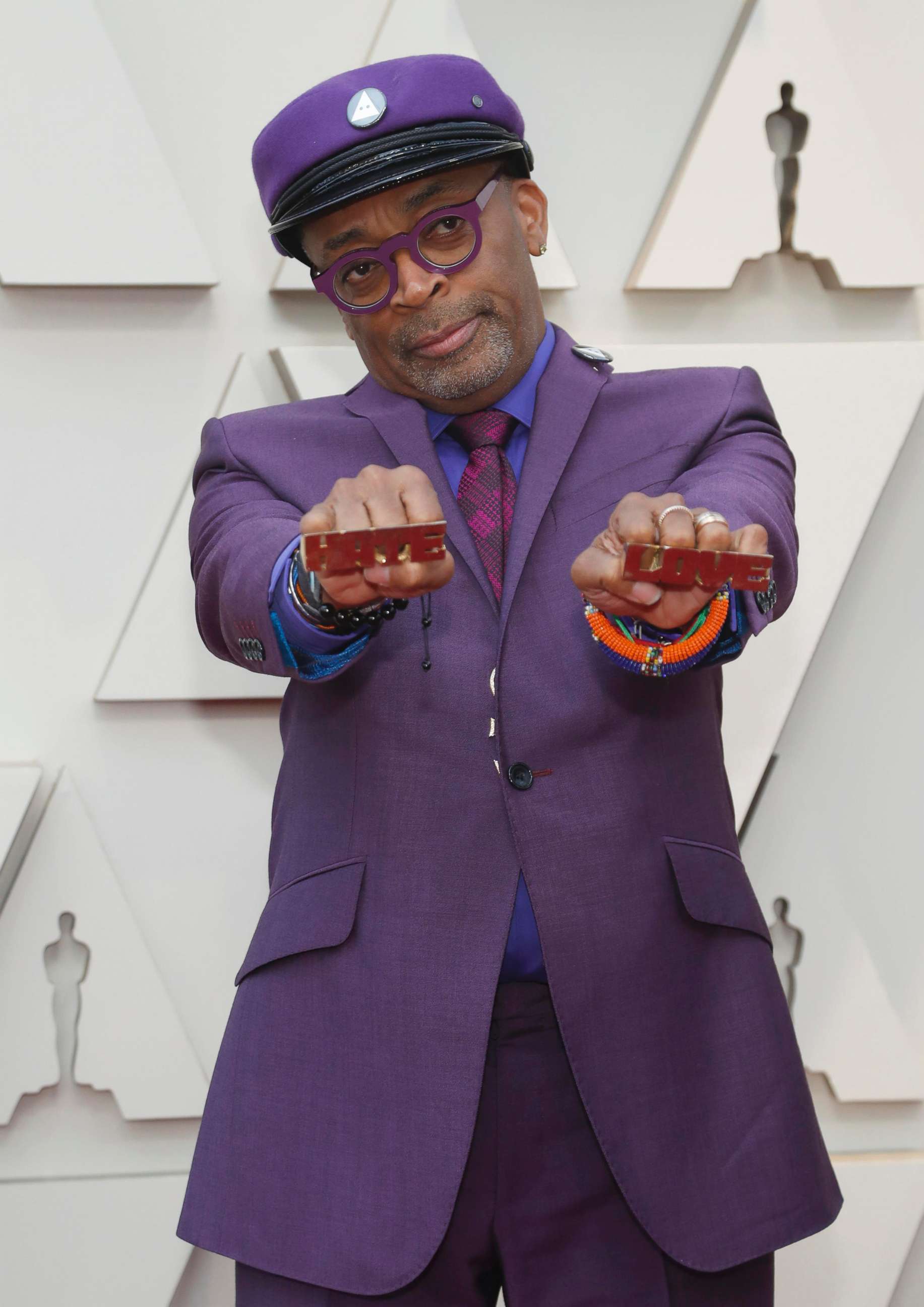 PHOTO: Director Spike Lee holds knuckle rings reading "Hate" and "Love" on the red carpet at the Oscars in Hollywood, Calif., Feb. 24, 2019.