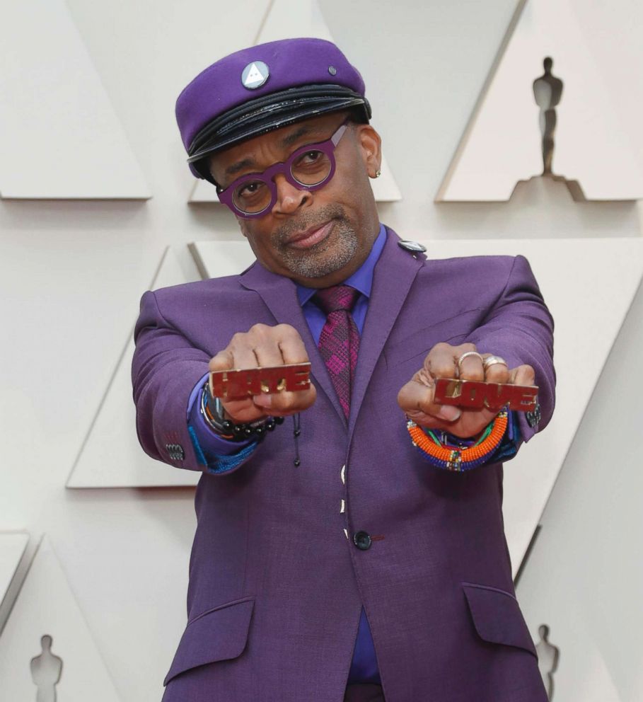 PHOTO: Director Spike Lee holds knuckle rings reading "Hate" and "Love" on the red carpet at the Oscars in Hollywood, Calif., Feb. 24, 2019.