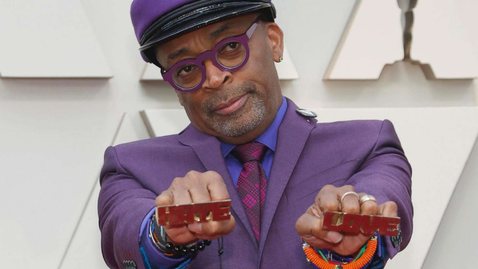 PHOTO: Director Spike Lee holds knuckle rings reading "Hate" and "Love" on the red carpet at the Oscars in Hollywood, Calif., Feb. 24, 2019.