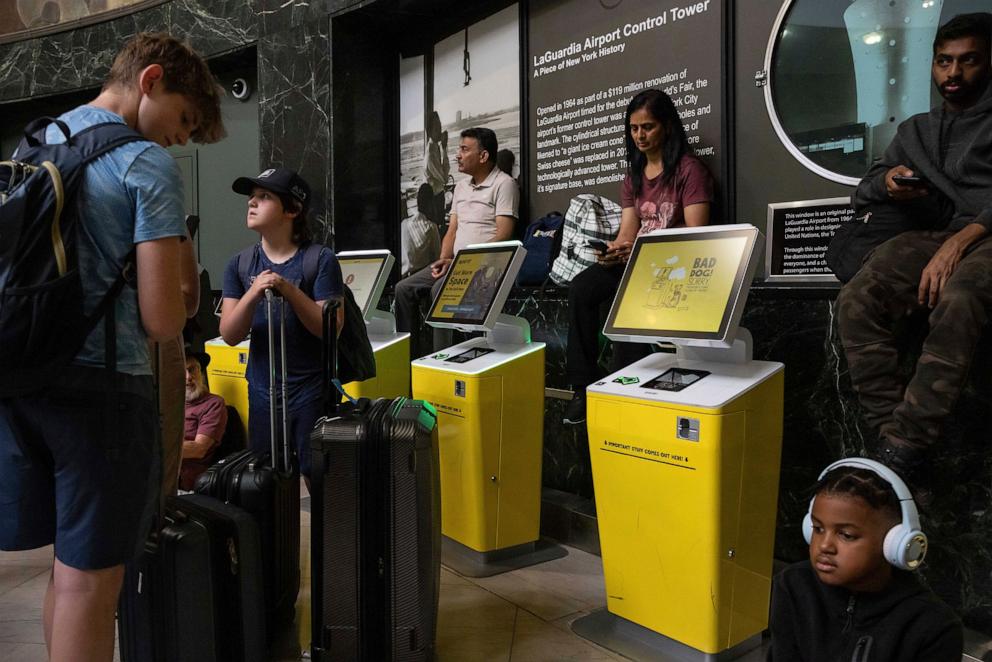 PHOTO: Customers wait at departure area for Spirit Airlines at LaGuardia Airport, July 19, 2024, in New York.