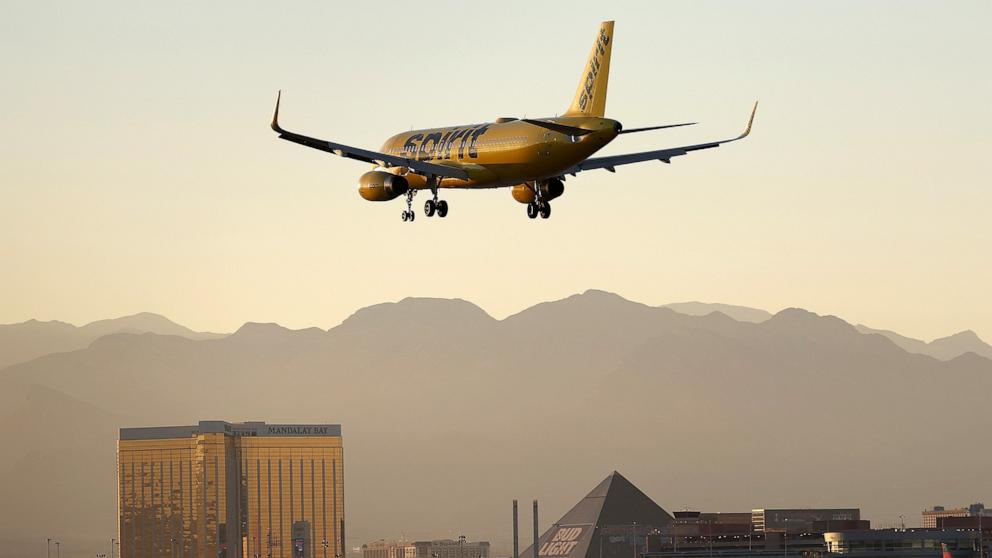 PHOTO: A Spirit Airlines plane lands at Harry Reid International Airport on October 14, 2022 in Las Vegas, Nevada.