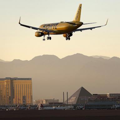 PHOTO: A Spirit Airlines plane lands at Harry Reid International Airport on October 14, 2022 in Las Vegas, Nevada.