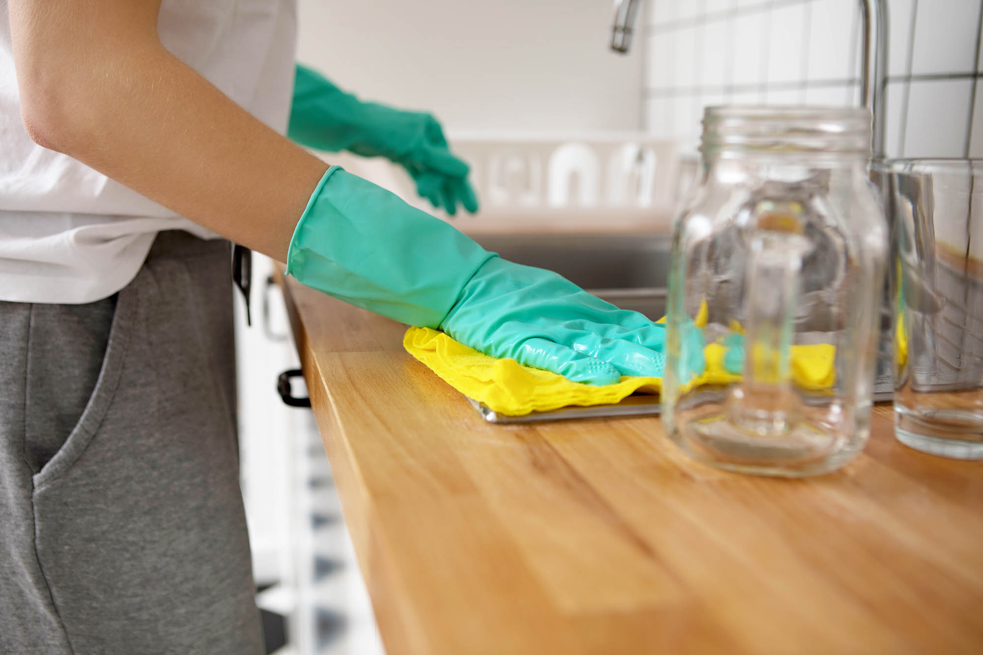 PHOTO: An undated stock photo of a woman wiping a table. 