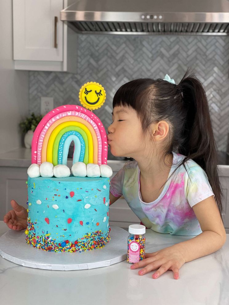 PHOTO: Ellis Tang with her rainbow sprinkle cake.