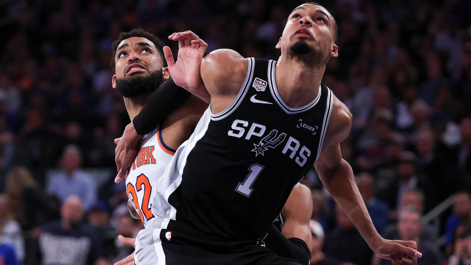 PHOTO: Victor Wembanyama #1 of the San Antonio Spurs and Karl-Anthony Towns #32 of the New York Knicks battle for position during the fourth quarter in Game Three of the 2026 NBA Finals at Madison Square Garden on June 08, 2026 in New York City.