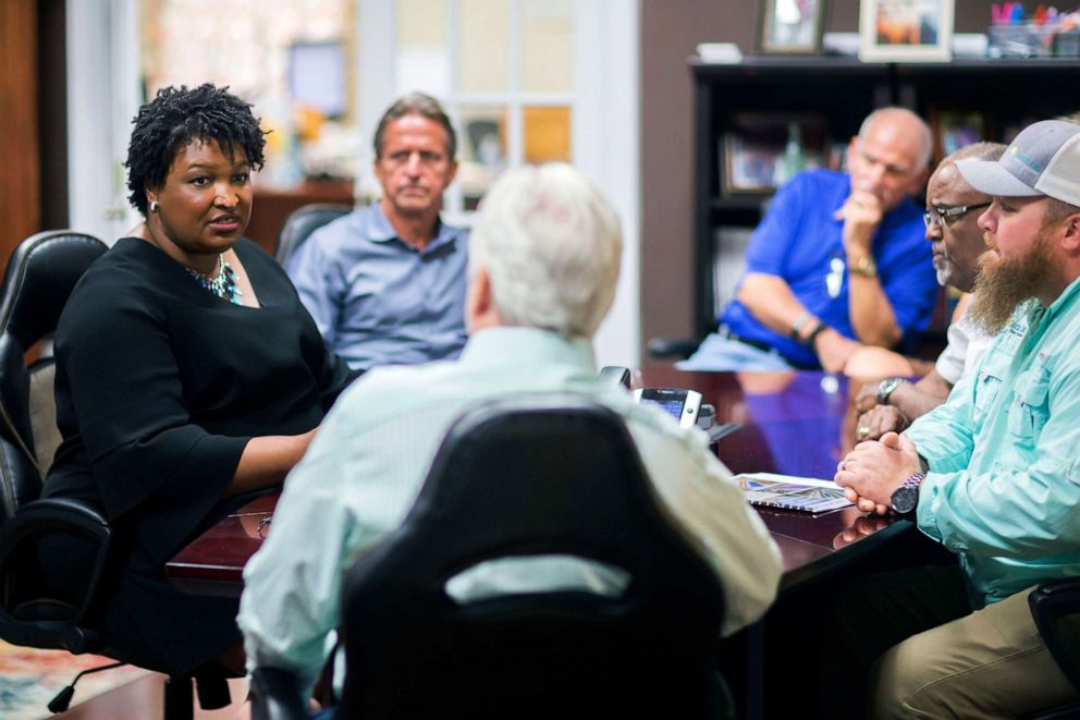 PHOTO: Georgia Democratic gubernatorial candidate Stacey Abrams meets with a group of employees at the Coastal Solar office during a campaign stop to announce her "Jobs for Georgia Plan", July 26, 2018, in Hinesville, Ga.