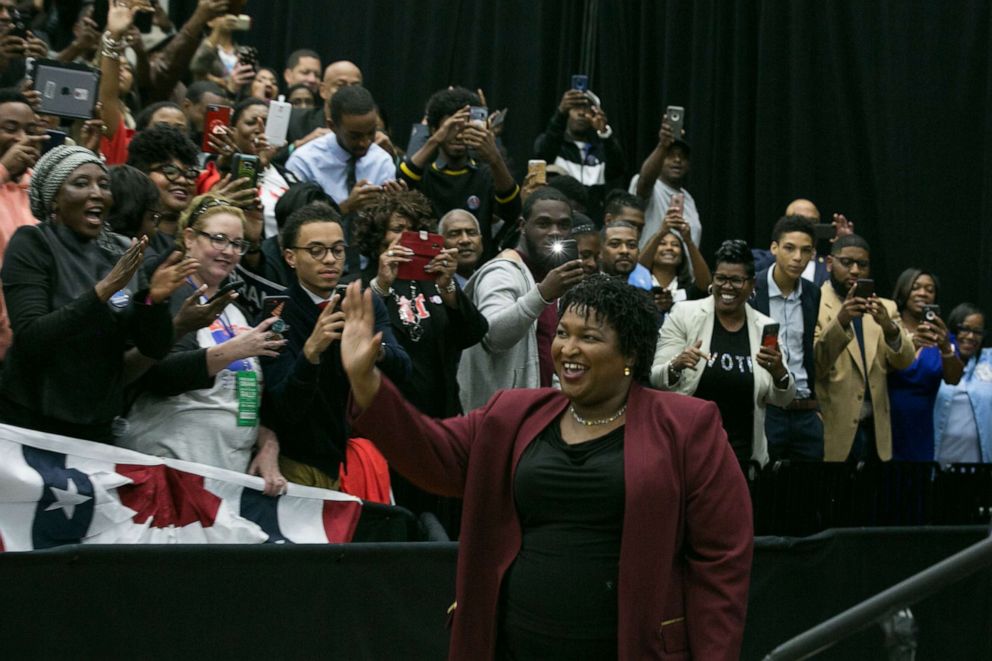 PHOTO: Georgia Democratic Gubernatorial candidate Stacey Abrams enters the arena for a campaign rally at Morehouse College with Former US President Barack Obama on Nov. 2, 2018, in Atlanta.