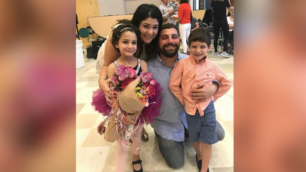 PHOTO: Maya Stanton poses with her family after a dance recital.