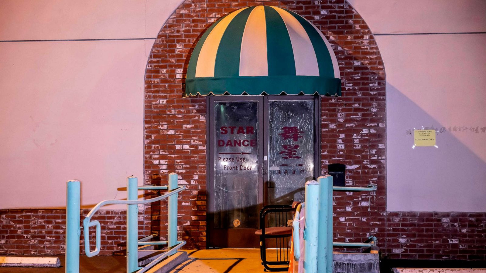 PHOTO: The side exit at the Star Ballroom Dance Studio after police took down the crime scene tape, Jan. 22, 2023, in Monterey Park, Calif.