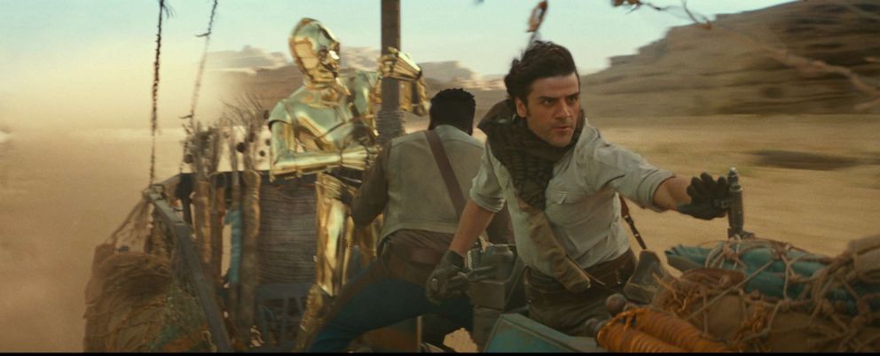 PHOTO: C3PO, John Boyega and Oscar Isaac appear in a scene from the 2019 film, "Star Wars: The Rise of Skywalker."