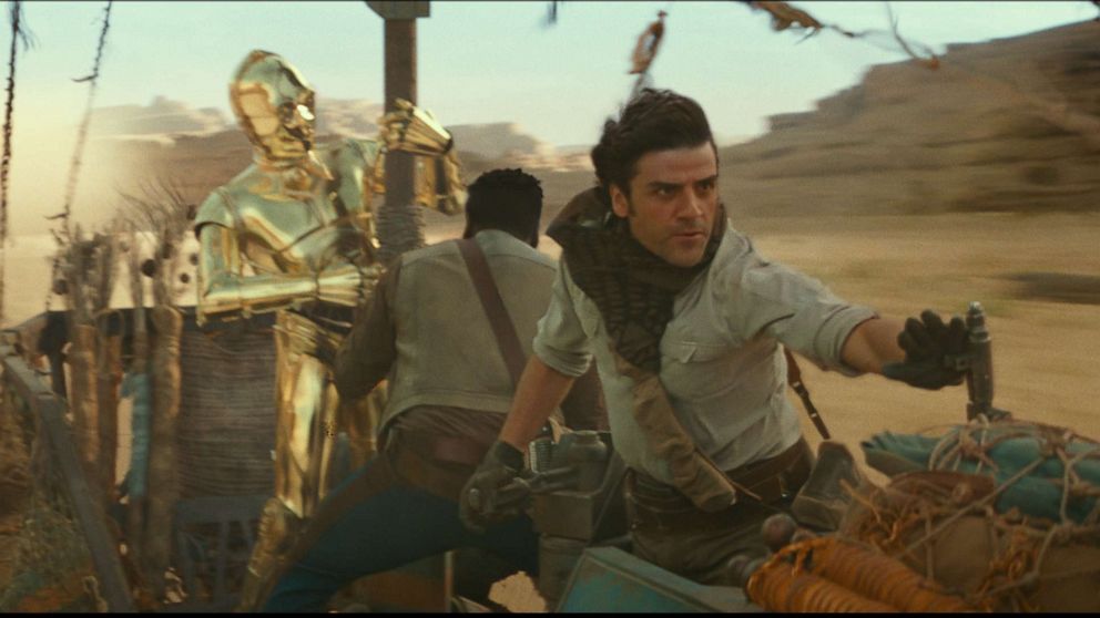 PHOTO: C3PO, John Boyega and Oscar Isaac appear in a scene from the 2019 film, "Star Wars: The Rise of Skywalker."