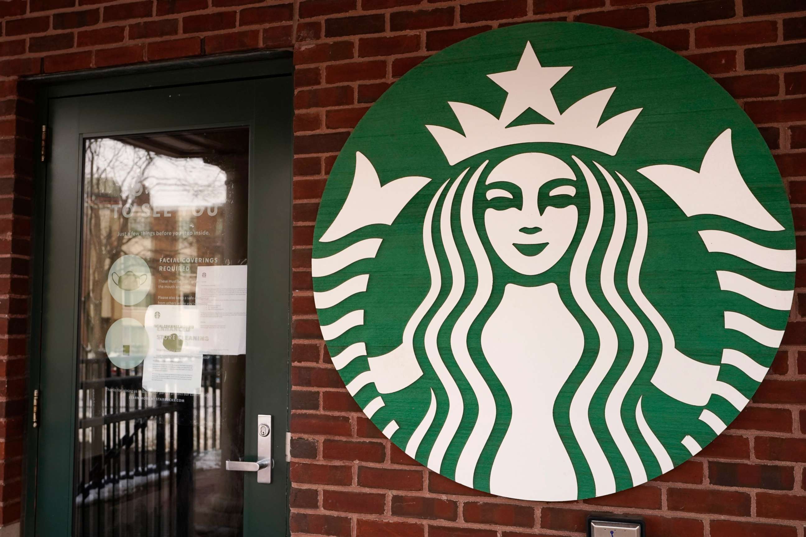 PHOTO: A Starbucks coffee company logo sign is seen at Palatine Metra train station in Palatine, Ill., Jan. 6, 2021.