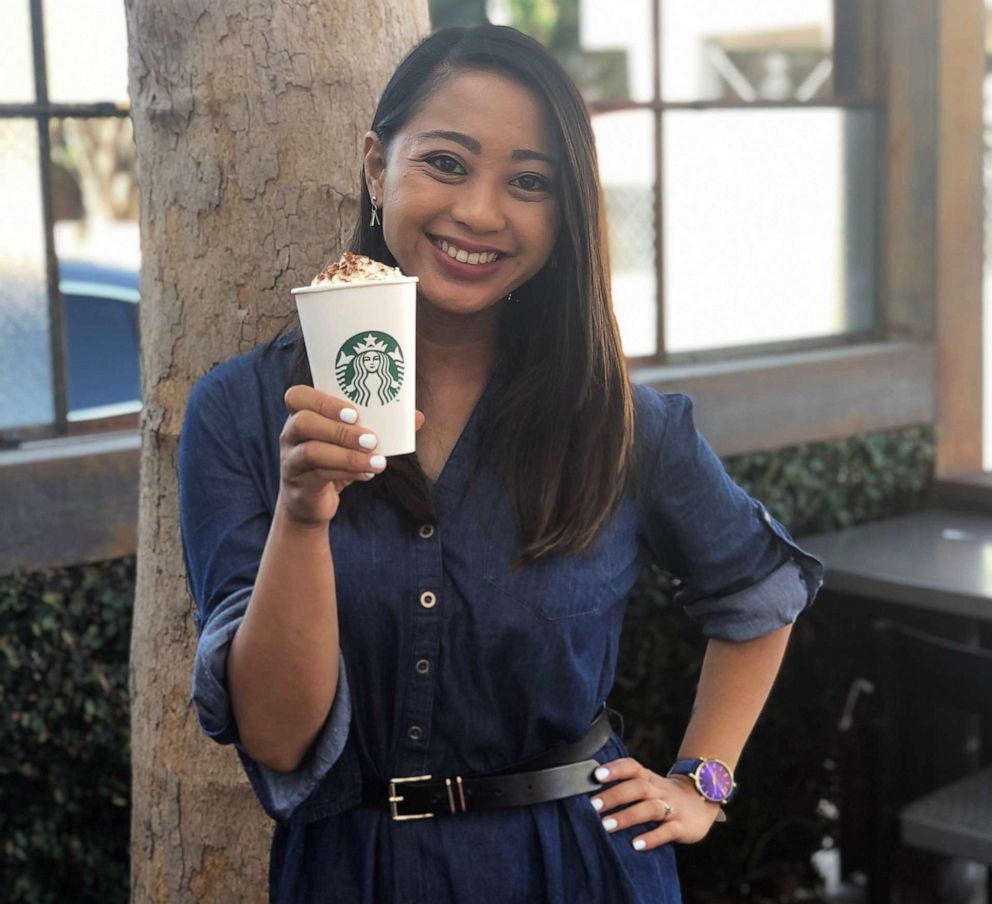 PHOTO: ABC News Fellow Angeline Bernabe holds a Pumpkin Spice Latte at a Starbucks location on Melrose Avenue in Los Angeles.