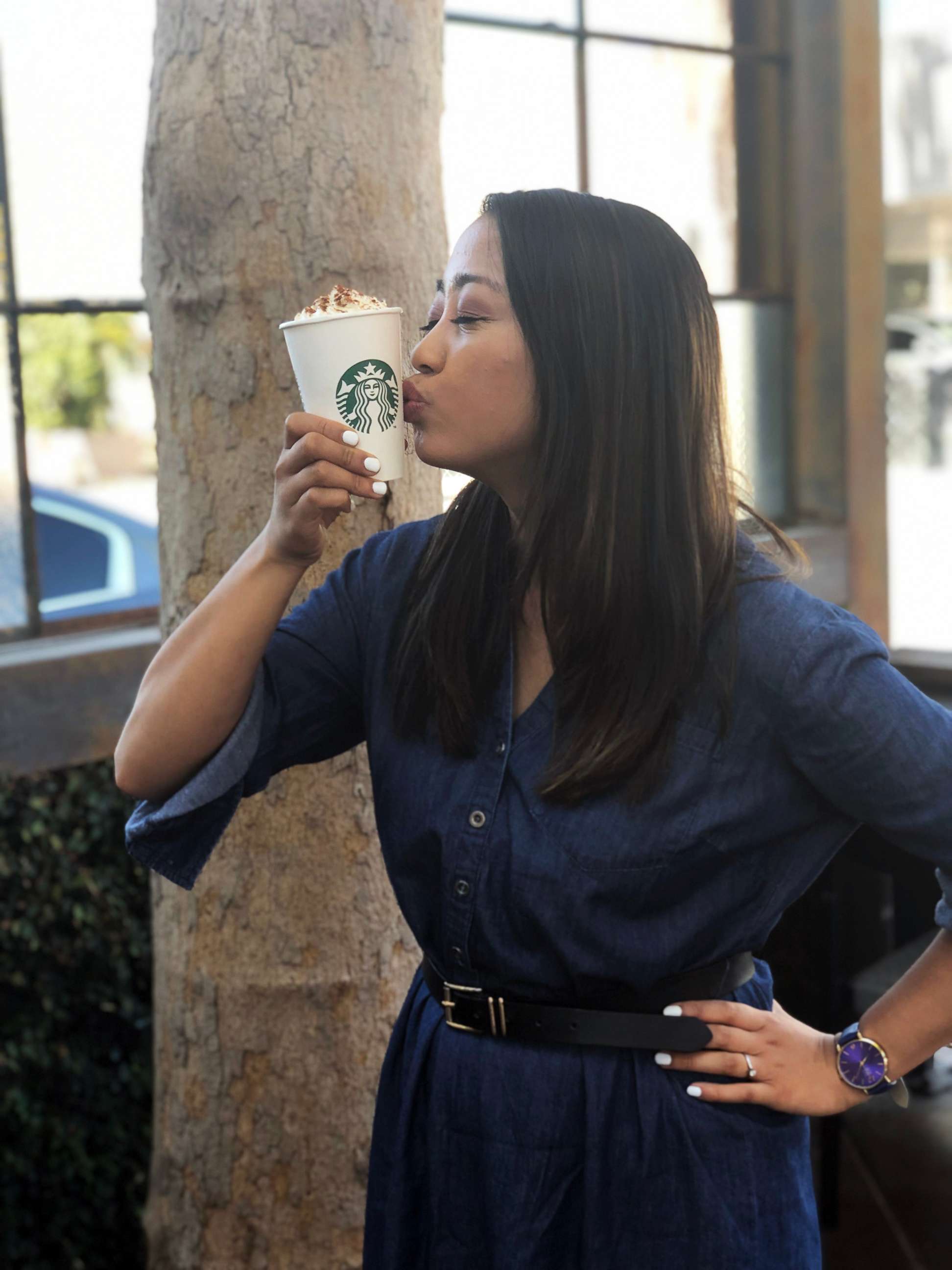 PHOTO: ABC News Fellow Angeline Bernabe holds a Pumpkin Spice Latte at a Starbucks location on Melrose Avenue in Los Angeles.