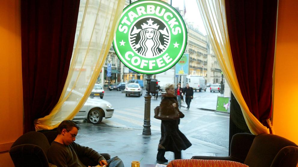 PHOTO: In this Jan. 16, 2004, file photo, a customer drinks coffee in a new Starbucks store in Paris.