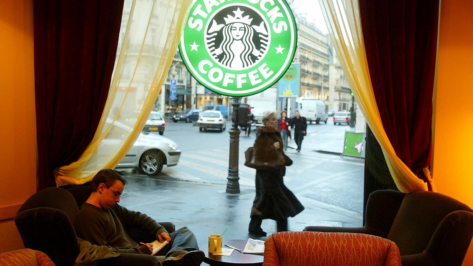 PHOTO: In this Jan. 16, 2004, file photo, a customer drinks coffee in a new Starbucks store in Paris.