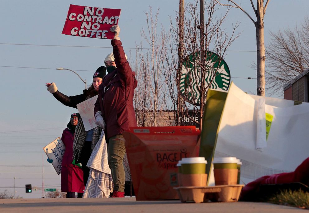 PHOTO: Starbucks employees work the picket line during a one-day walkout involving more than 100 stores nationwide on Thursday, Nov. 17, 2022 in St. Louis, Mo.