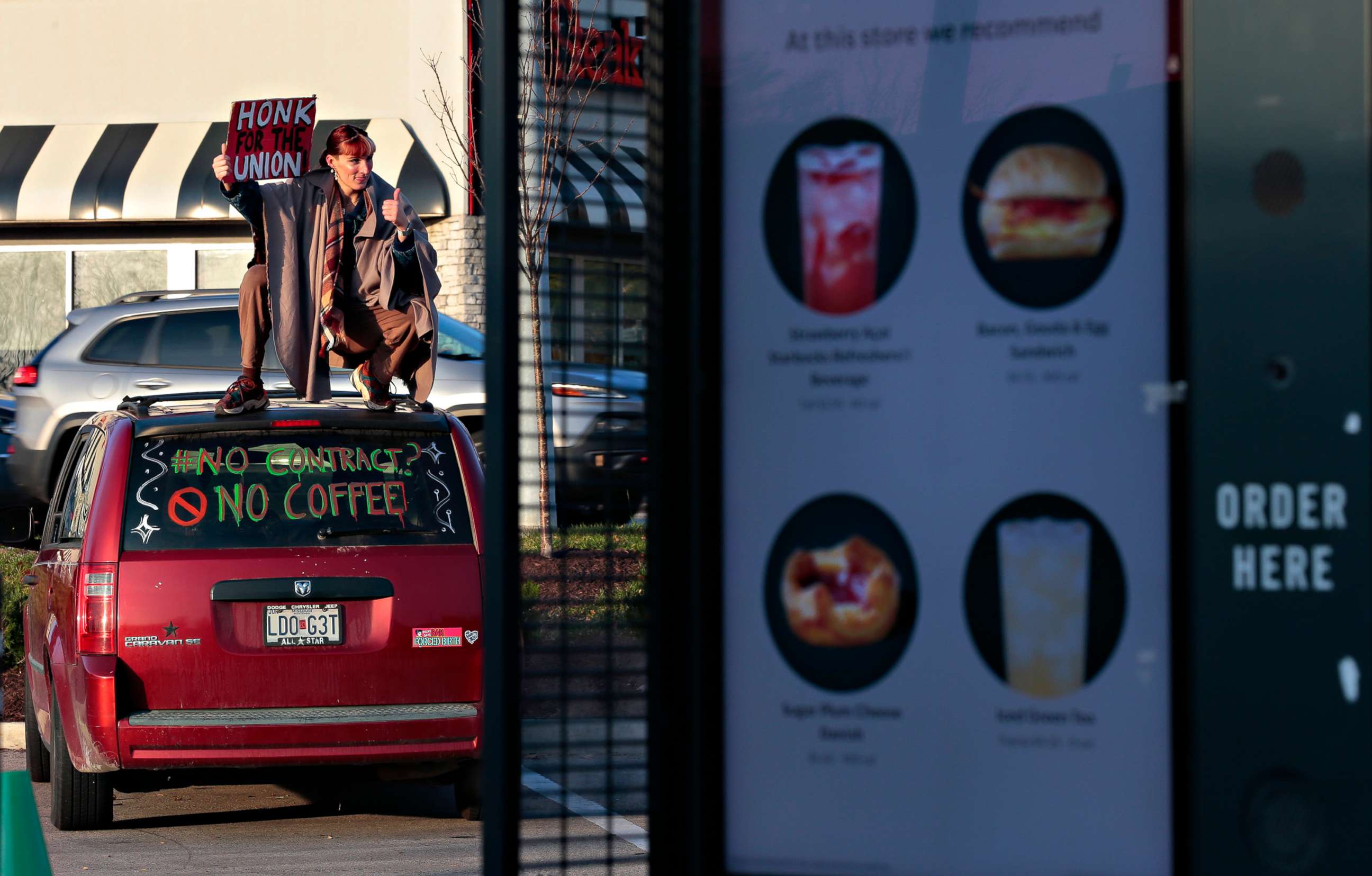 PHOTO: A Starbucks barista tries to divert customers from the drive-up window as she joins a one-day walkout involving more than 100 stores nationwide on Thursday, Nov. 17, 2022 in St. Louis, Mo.