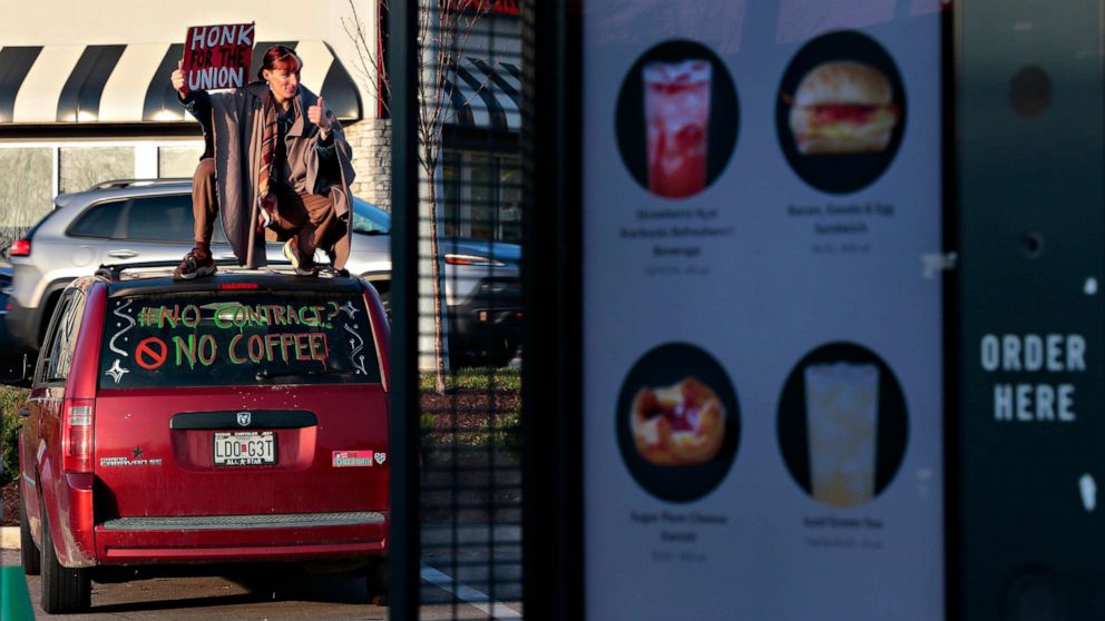 PHOTO: A Starbucks barista tries to divert customers from the drive-up window as she joins a one-day walkout involving more than 100 stores nationwide on Thursday, Nov. 17, 2022 in St. Louis, Mo.