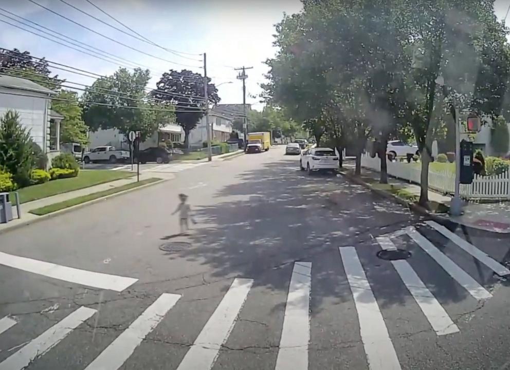 PHOTO: Security camera footage released by the MTA shows an MTA bus driver rescue a toddler walking down a street in Staten Island on June 19, 2024.