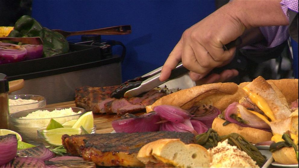 PHOTO: Chef Josh Capon cooks a Tomahawk steak with onions and roasted peppers.
