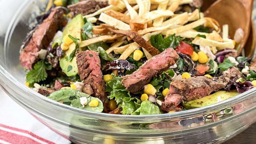 PHOTO: A southwestern steak salad with corn and crispy tortilla strips.