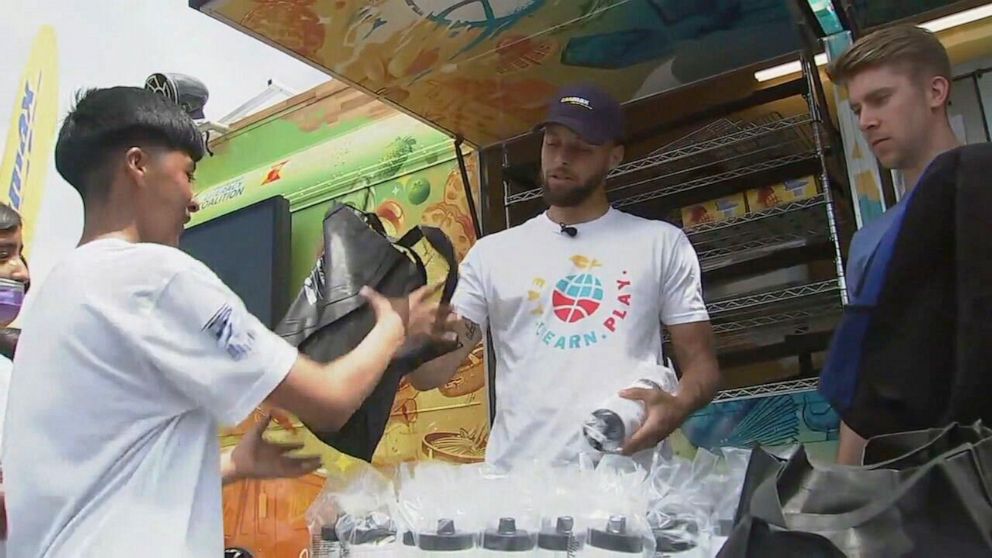 PHOTO: Steph Curry surprised middle school students at an event put on by his Eat.Play.Learn Foundation, on June 5, 2023, in Oakland, Calif.