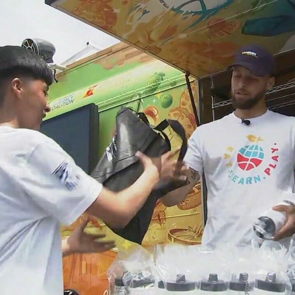 VIDEO: NBA star Stephen Curry surprises middle schoolers with meals, books and soccer drills 