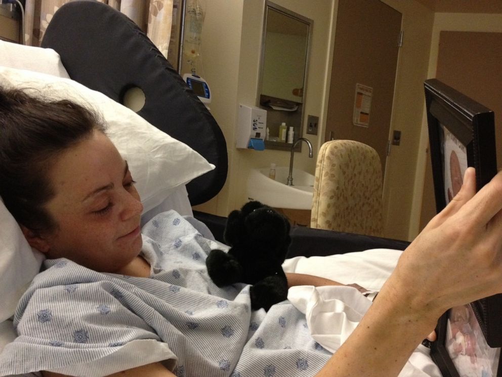 PHOTO: Camre Curto looks at a picture of her son, Gavin, during her recovery.